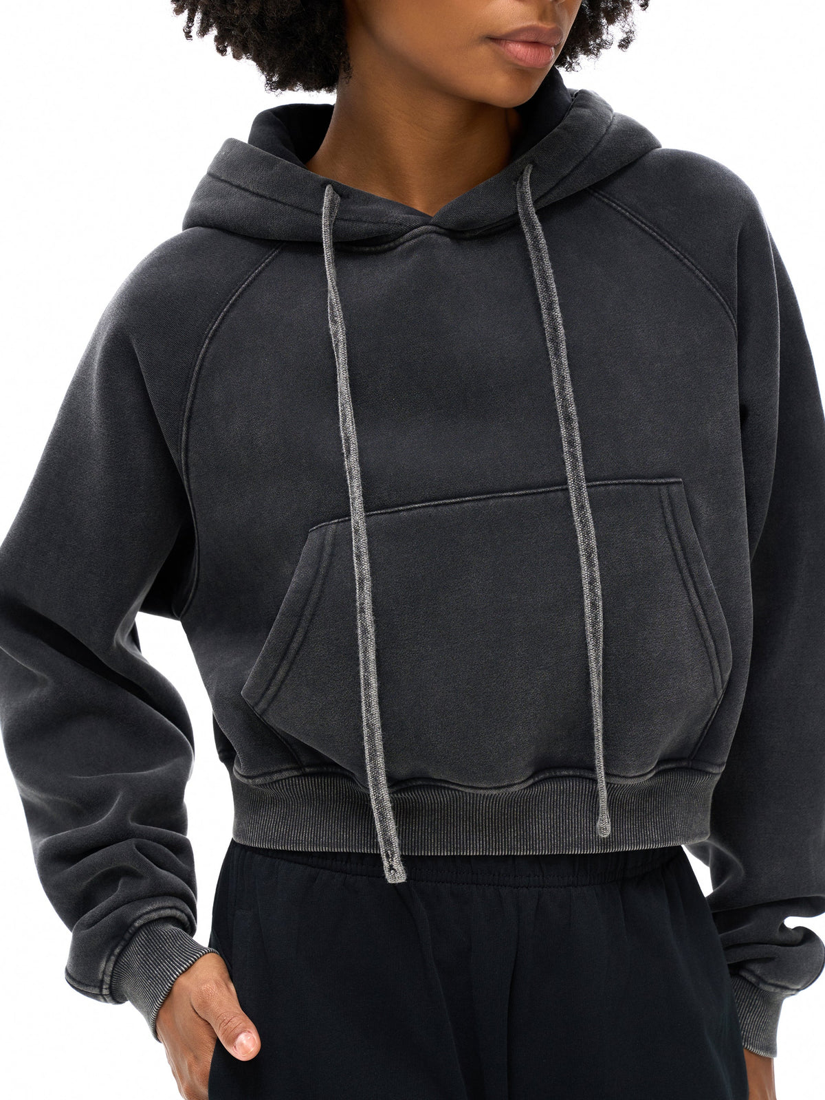 Model wearing a washed charcoal cropped hoodie with drawstrings – ZELX